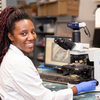 Image of Student using Microscope 